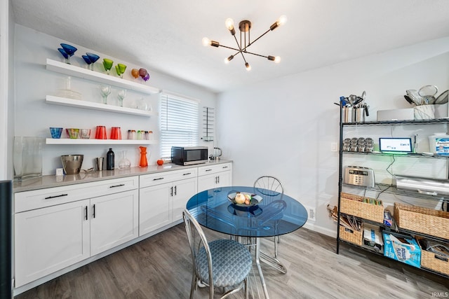 241 Sylvan Glen Dr, South Bend, IN 46615 - dining space featuring a chandelier and wood finished floors