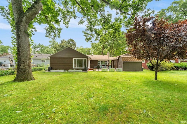 241 Sylvan Glen Dr, South Bend, IN 46615 - rear view of property featuring a storage shed