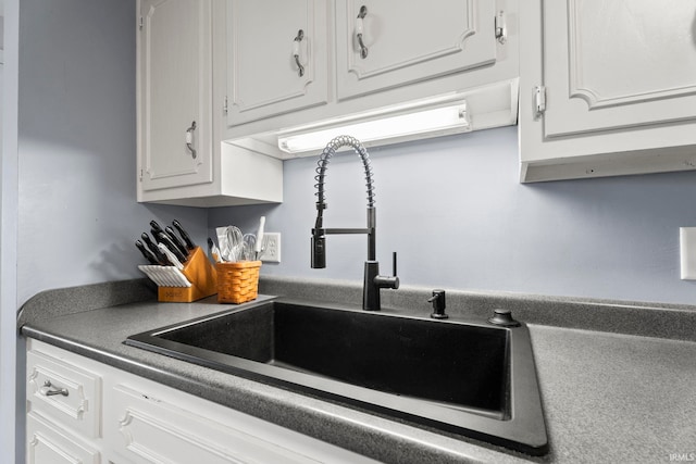 17135 Old 24 Rd, Woodburn, IN 46797 - kitchen featuring white cabinetry and dark countertops