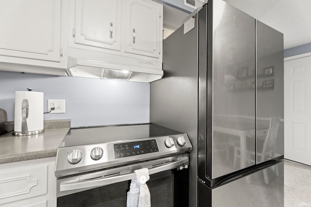 17135 Old 24 Rd, Woodburn, IN 46797 - kitchen featuring appliances with stainless steel finishes, under cabinet range hood, white cabinetry, and light countertops