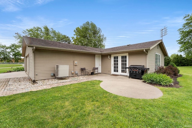 17135 Old 24 Rd, Woodburn, IN 46797 - rear view of house featuring a yard, french doors, and a patio
