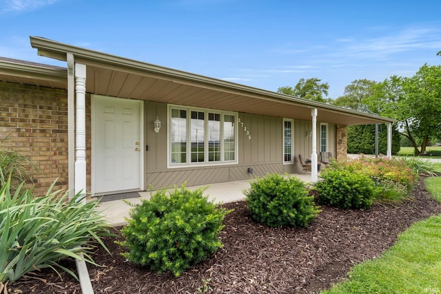 17135 Old 24 Rd, Woodburn, IN 46797 - view of front facade featuring covered porch