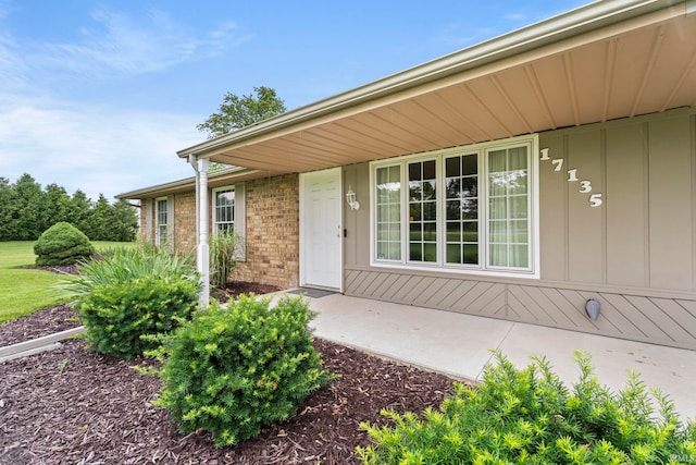 17135 Old 24 Rd, Woodburn, IN 46797 - property entrance with board and batten siding and brick siding