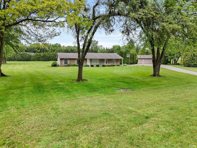 17135 Old 24 Rd, Woodburn, IN 46797 - single story home featuring a front lawn