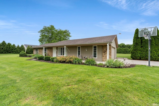 17135 Old 24 Rd, Woodburn, IN 46797 - ranch-style home featuring a front yard, a garage, and concrete driveway
