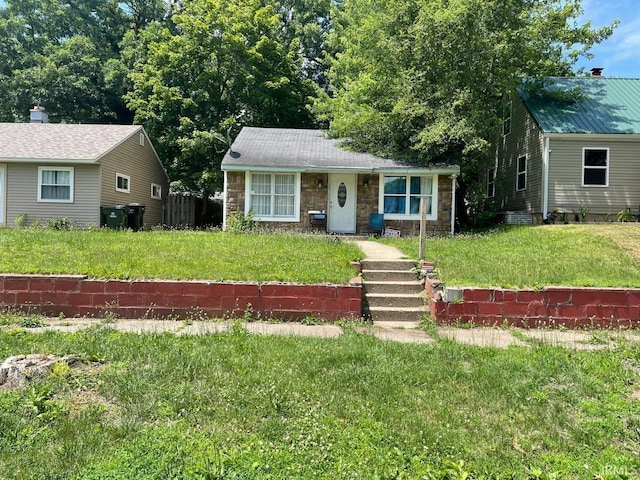 1741 N Brookfield St, South Bend, IN 46628 - bungalow-style house with stone siding and a front lawn