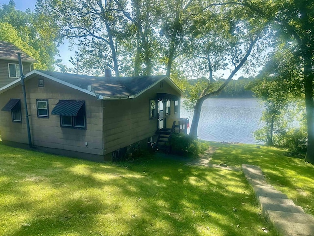 1995 S 445 E, Royer Lake, Lagrange, IN 46761 - view of property exterior featuring a yard, a water view, entry steps, and a chimney