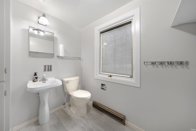 1545 Werling Rd, New Haven, IN 46774 - bathroom featuring a baseboard heating unit and wood finished floors