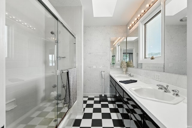 18 Ems T13E Ln, Leesburg, IN 46538 - full bathroom with tile patterned floors, double vanity, an enclosed shower, and a skylight