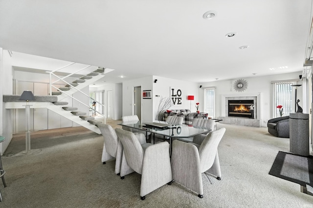 18 Ems T13E Ln, Leesburg, IN 46538 - carpeted dining space with a fireplace, stairs, and recessed lighting