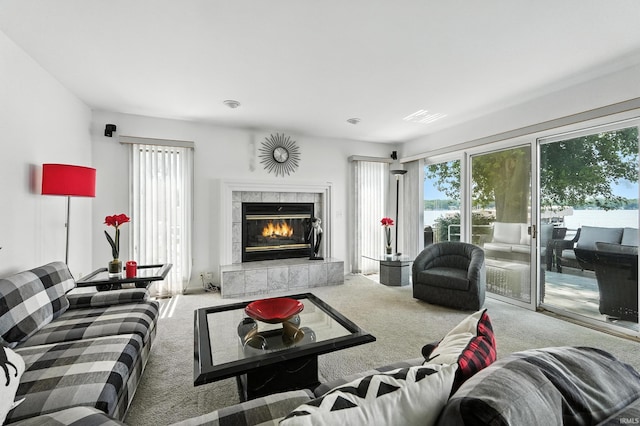 18 Ems T13E Ln, Leesburg, IN 46538 - carpeted living area featuring a tiled fireplace and a water view