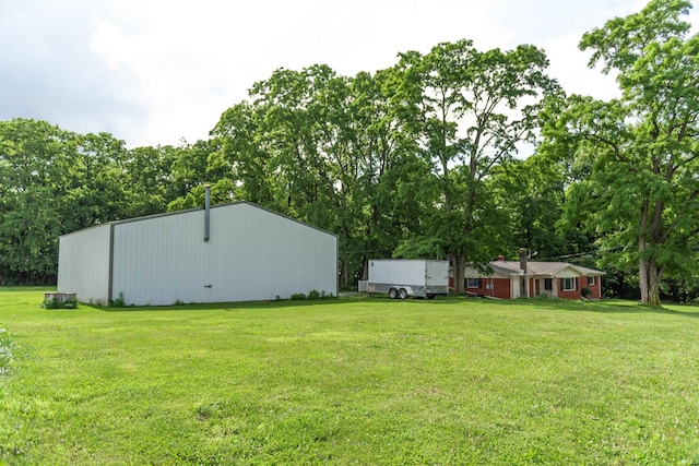 3557 N 150 E, Camden, IN 46917 - view of grassy yard featuring a pole building, view of scattered trees, and an outdoor structure
