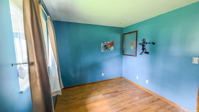 3557 N 150 E, Camden, IN 46917 - spare room featuring wood finished floors and baseboards