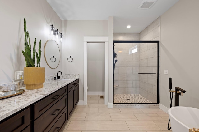 4685 N Triple Crown Dr, Bloomington, IN 47404 - bathroom featuring a stall shower, double vanity, a freestanding bath, and tile patterned floors