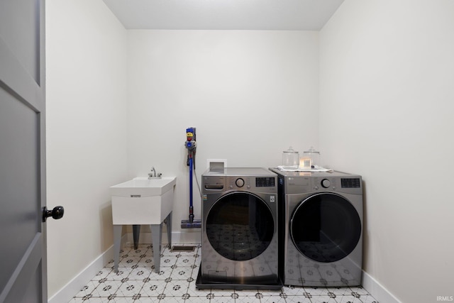 4685 N Triple Crown Dr, Bloomington, IN 47404 - laundry area featuring washer and dryer and light flooring