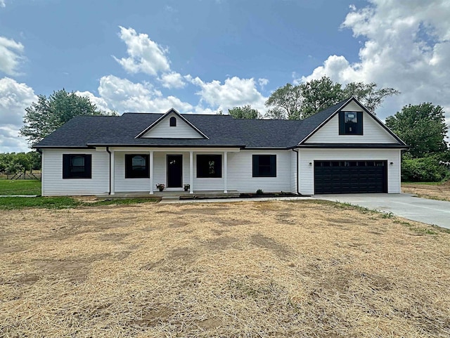1405 Rosewood Dr, Washington, IN 47501 - view of front of home featuring concrete driveway, a porch, a shingled roof, and a garage