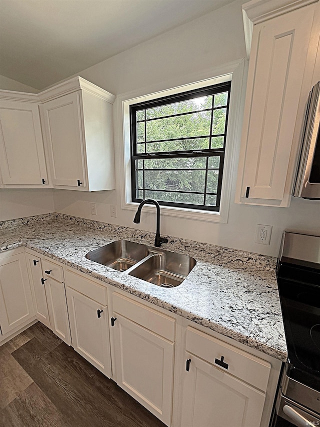 1405 Rosewood Dr, Washington, IN 47501 - kitchen with stainless steel electric range, white cabinetry, dark wood-style floors, and light stone countertops