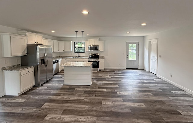 1405 Rosewood Dr, Washington, IN 47501 - kitchen featuring appliances with stainless steel finishes, recessed lighting, white cabinets, dark wood finished floors, and a center island