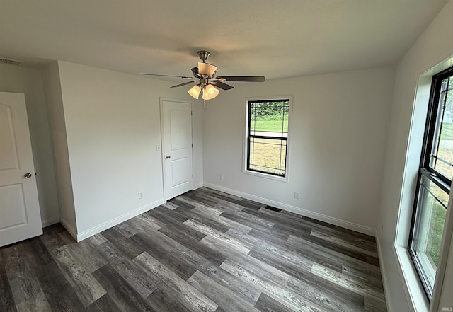 1405 Rosewood Dr, Washington, IN 47501 - empty room featuring dark wood finished floors and ceiling fan