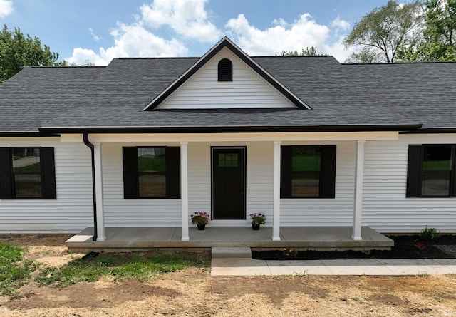 1405 Rosewood Dr, Washington, IN 47501 - view of front of house featuring covered porch and a shingled roof