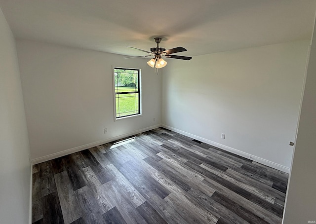 1405 Rosewood Dr, Washington, IN 47501 - spare room with a ceiling fan and dark wood finished floors