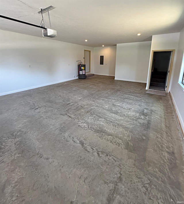 1405 Rosewood Dr, Washington, IN 47501 - garage with a garage door opener, water heater, and recessed lighting