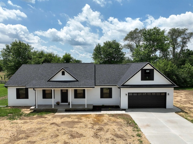 1405 Rosewood Dr, Washington, IN 47501 - modern inspired farmhouse featuring driveway, roof with shingles, and covered porch
