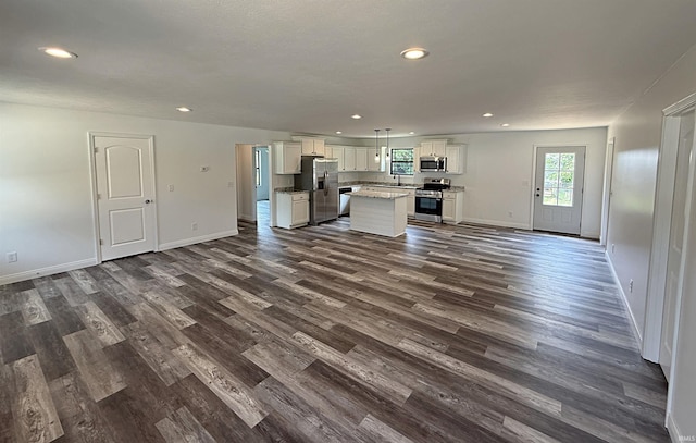 1405 Rosewood Dr, Washington, IN 47501 - unfurnished living room with dark wood-type flooring and recessed lighting