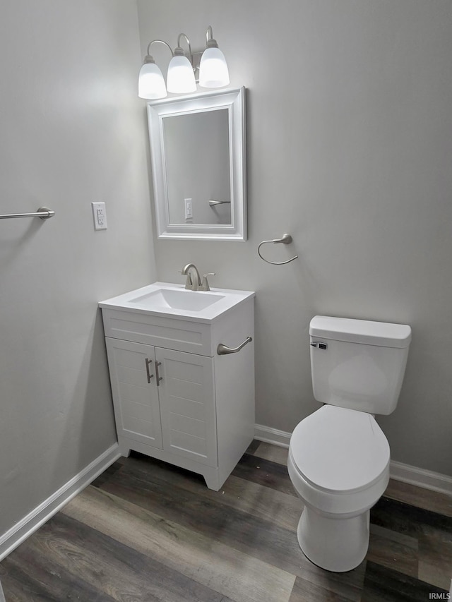 104 Fremont Ln, Decatur, IN 46733 - half bathroom with vanity and wood finished floors