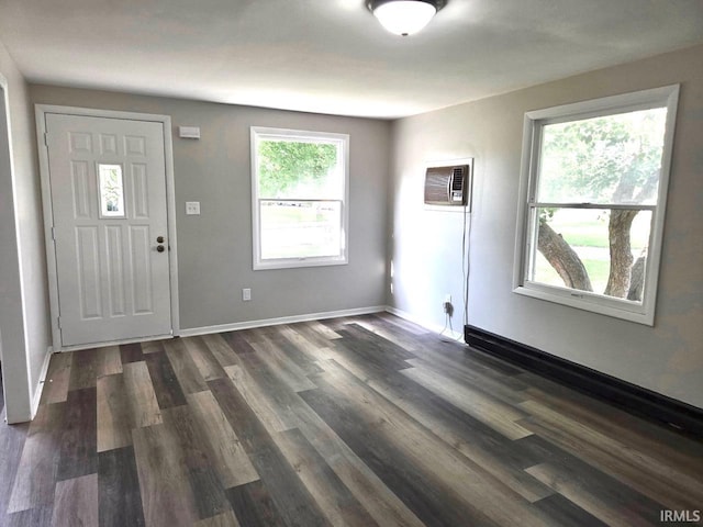 104 Fremont Ln, Decatur, IN 46733 - entrance foyer featuring dark wood-type flooring and a wall mounted air conditioner