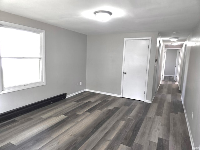 104 Fremont Ln, Decatur, IN 46733 - unfurnished room featuring dark wood-type flooring and baseboards