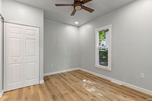 610 N 5th St, Goshen, IN 46528 - unfurnished bedroom featuring light wood-type flooring, a closet, recessed lighting, and a ceiling fan