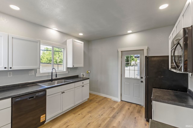 610 N 5th St, Goshen, IN 46528 - kitchen featuring dishwasher, stainless steel microwave, healthy amount of natural light, dark countertops, and recessed lighting