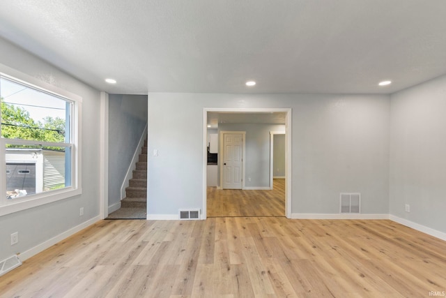 610 N 5th St, Goshen, IN 46528 - empty room with stairs, light wood-style flooring, and recessed lighting