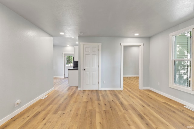 610 N 5th St, Goshen, IN 46528 - spare room featuring light wood-style flooring and recessed lighting