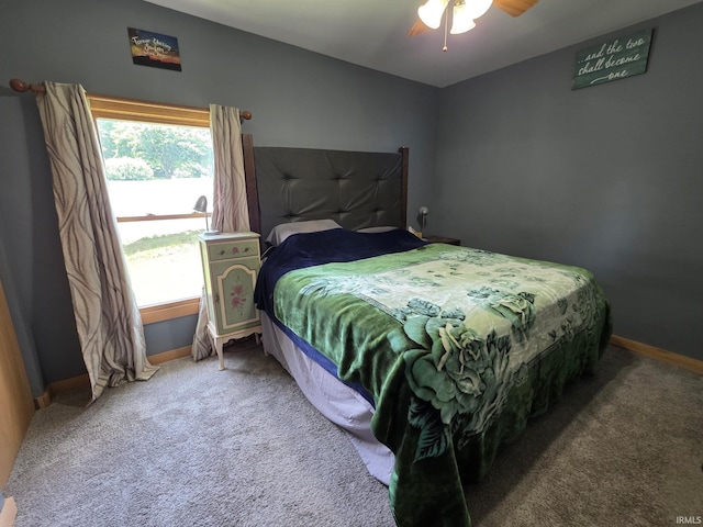 826 SE 2nd St, Washington, IN 47501 - carpeted bedroom with baseboards and ceiling fan