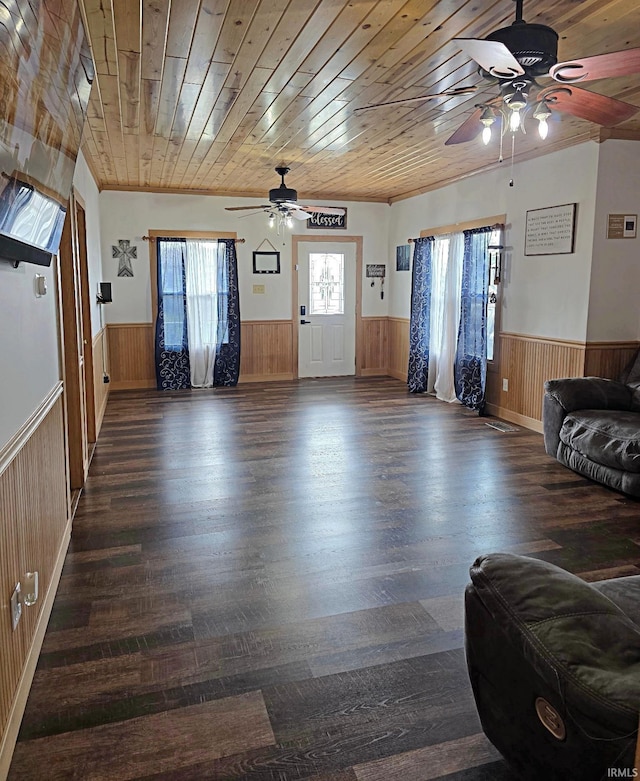 826 SE 2nd St, Washington, IN 47501 - foyer entrance with a wainscoted wall, a ceiling fan, wood walls, dark wood finished floors, and wooden ceiling