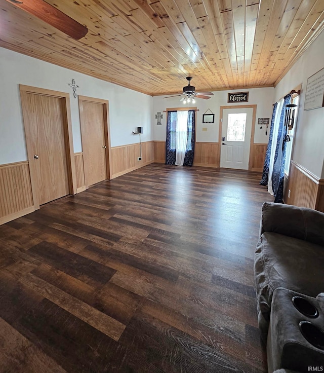 826 SE 2nd St, Washington, IN 47501 - living room featuring wainscoting, a ceiling fan, wood finished floors, and wooden ceiling