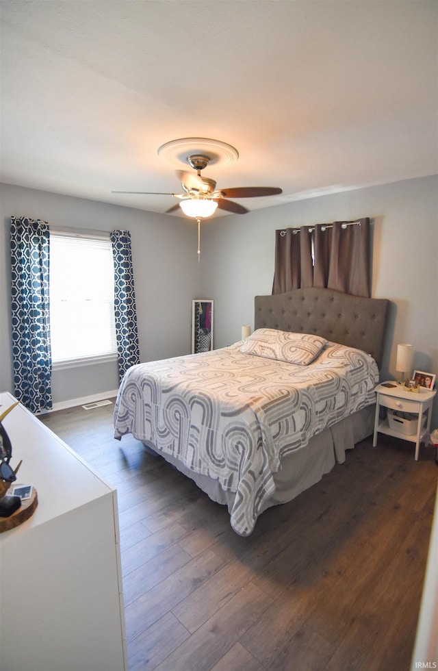 2221 Washington Ave, Evansville, IN 47714 - bedroom with dark wood-style floors and a ceiling fan