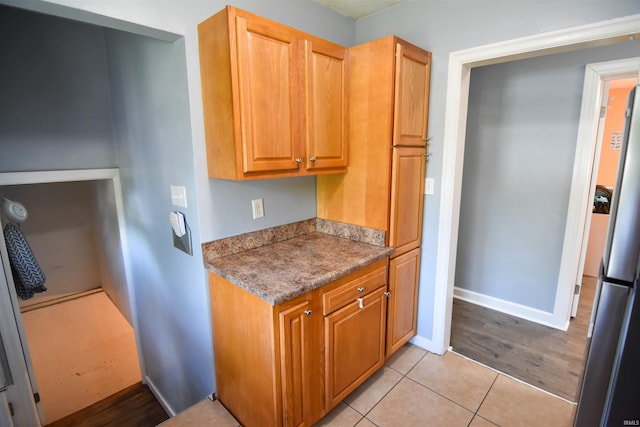 2221 Washington Ave, Evansville, IN 47714 - kitchen featuring light tile patterned floors and baseboards