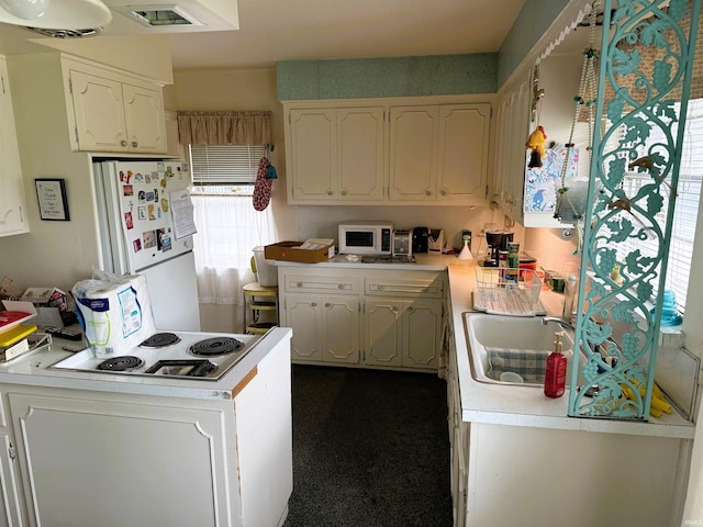100 S Fairlawn Ave, Evansville, IN 47714 - kitchen featuring white appliances, light countertops, and white cabinetry