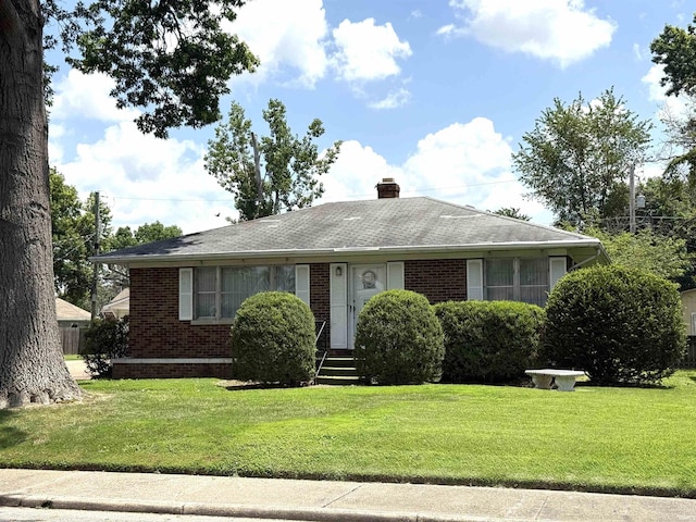 100 S Fairlawn Ave, Evansville, IN 47714 - view of front of property featuring brick siding, a front lawn, a chimney, and roof with shingles