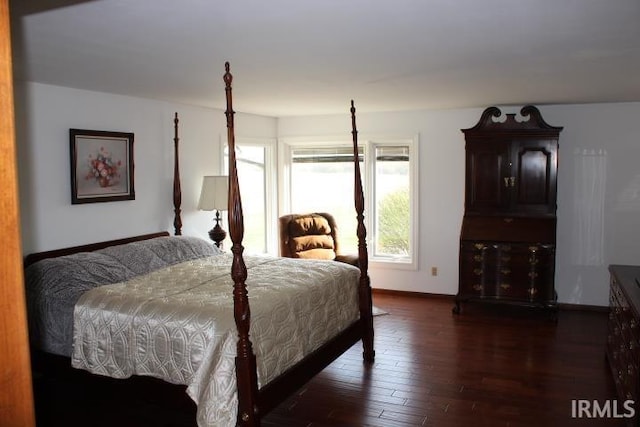 5933 Hoagland Rd, Hoagland, IN 46745 - bedroom featuring baseboards and dark wood-style flooring