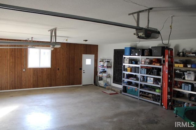 5933 Hoagland Rd, Hoagland, IN 46745 - garage with a garage door opener and wooden walls