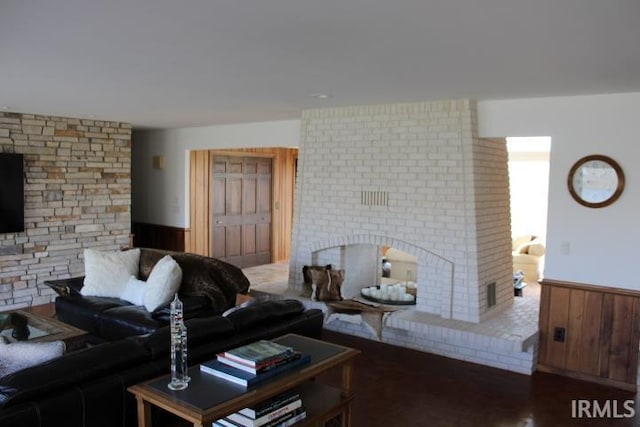 5933 Hoagland Rd, Hoagland, IN 46745 - living area featuring a brick fireplace and wainscoting