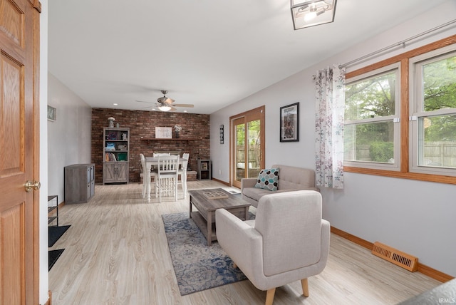 1205 Norma Jean Dr, Lafayette, IN 47909 - living room with a ceiling fan, wood finished floors, and a brick fireplace