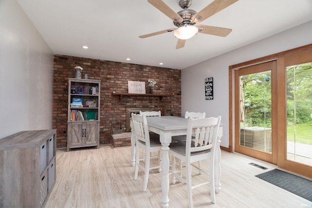 1205 Norma Jean Dr, Lafayette, IN 47909 - dining room featuring light wood finished floors, ceiling fan, recessed lighting, and brick wall