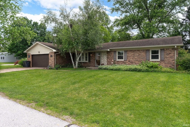 1205 Norma Jean Dr, Lafayette, IN 47909 - ranch-style home featuring brick siding, a front lawn, driveway, and a garage