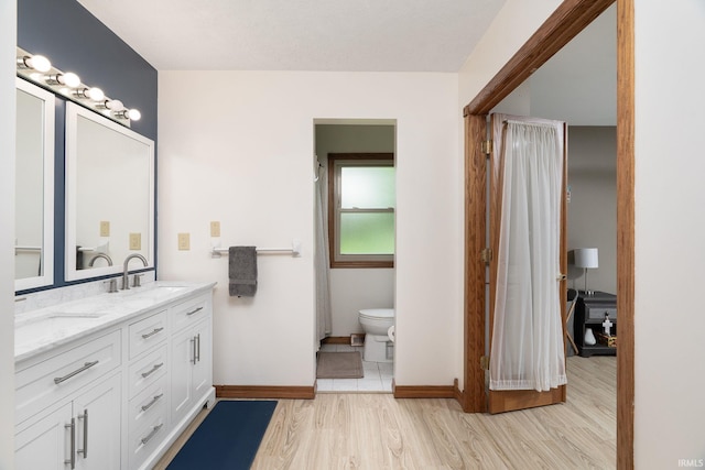 1205 Norma Jean Dr, Lafayette, IN 47909 - bathroom featuring double vanity and wood finished floors