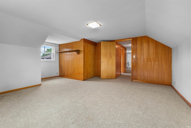 501 N Van Buren St, Auburn, IN 46706 - additional living space featuring vaulted ceiling, carpet, and wood walls